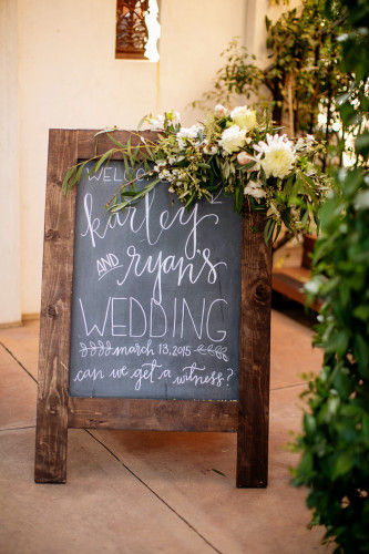 Chalkboard easel sign for wedding ceremony