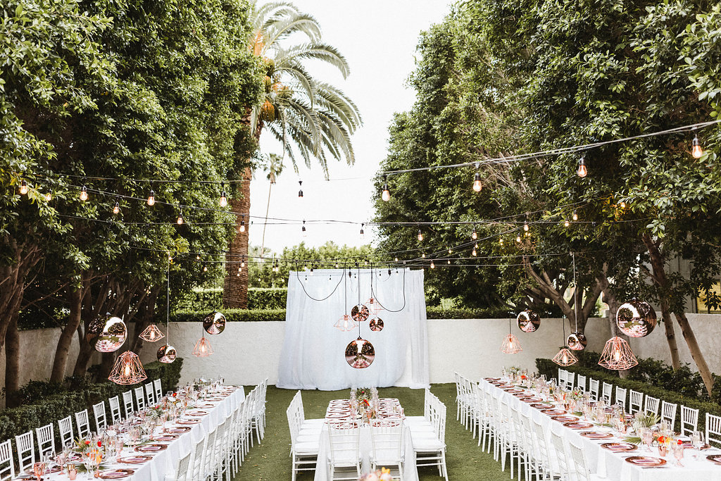 Avalon Palm Springs Wedding Reception with copper lanterns and copper table settings.