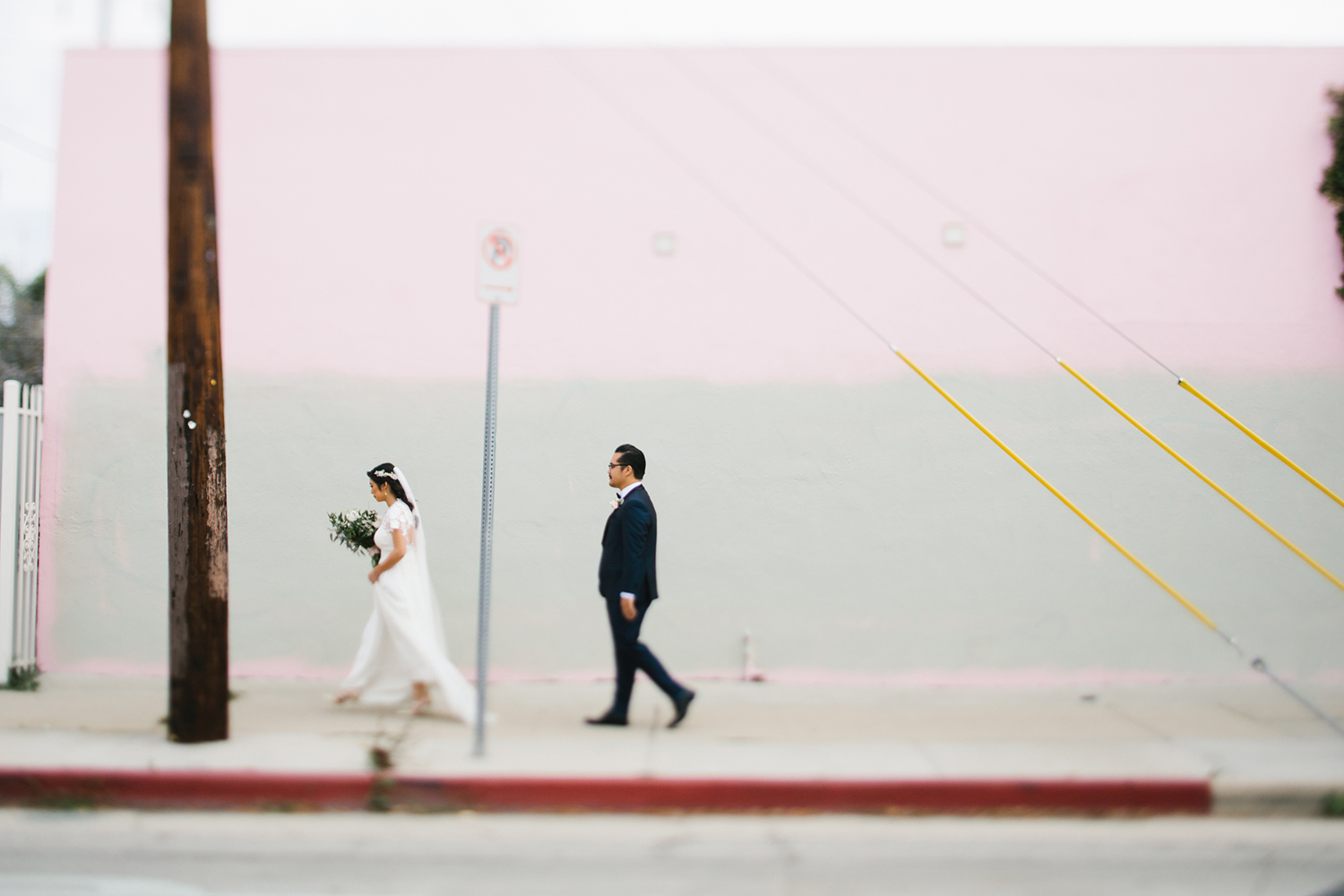 Modern walking photo with bride and groom