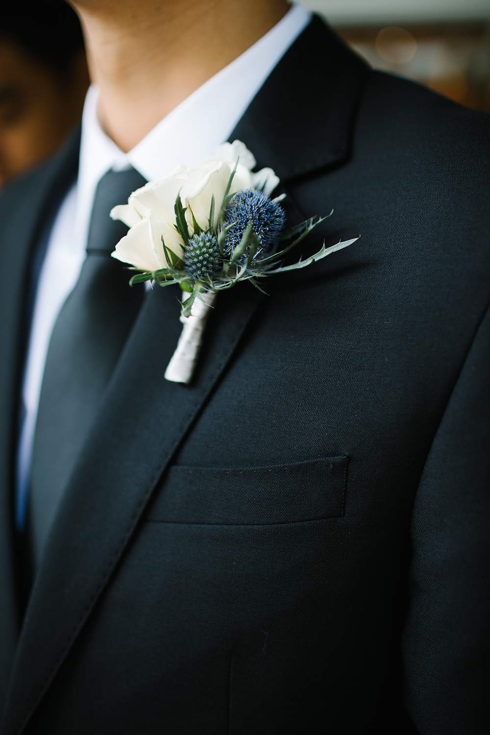 White and blue boutonniere